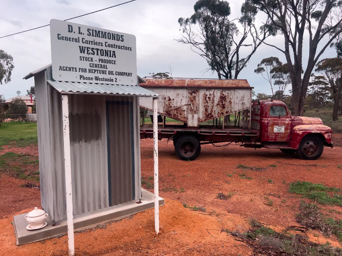 A vintage truck and weathered signage commemorate D.L. Simmonds, a reminder of Westonia's heritage in general transport.