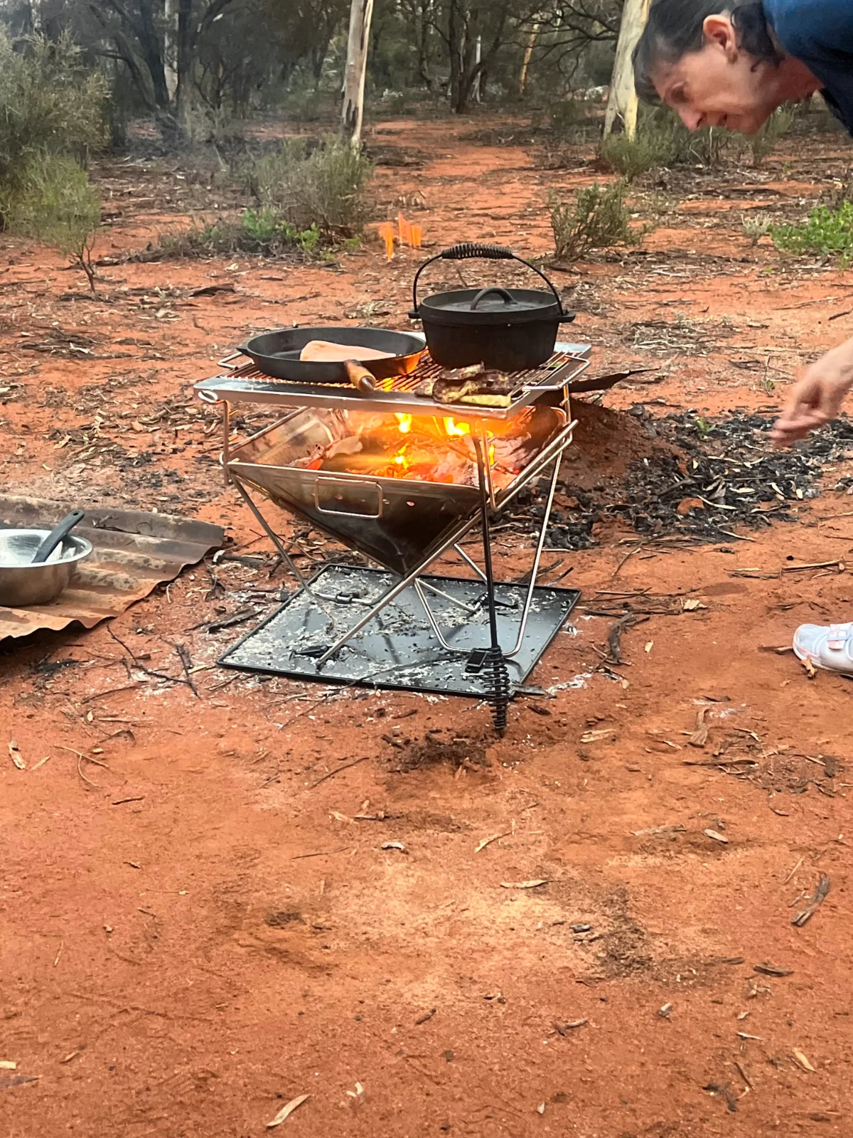 Dinner cooking over an open fire – the simple pleasures of camping near Higginsville.