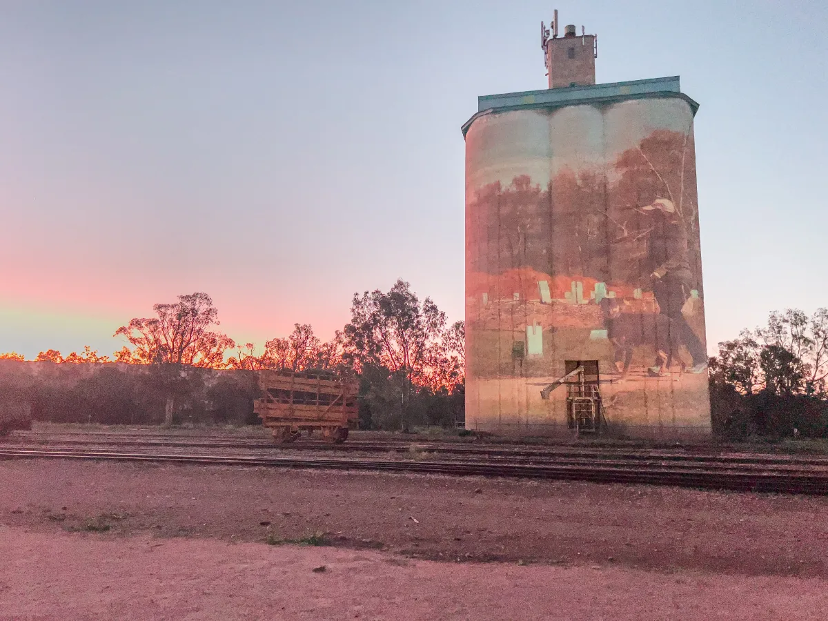 A silo painted with imagery, a tribute to history.
