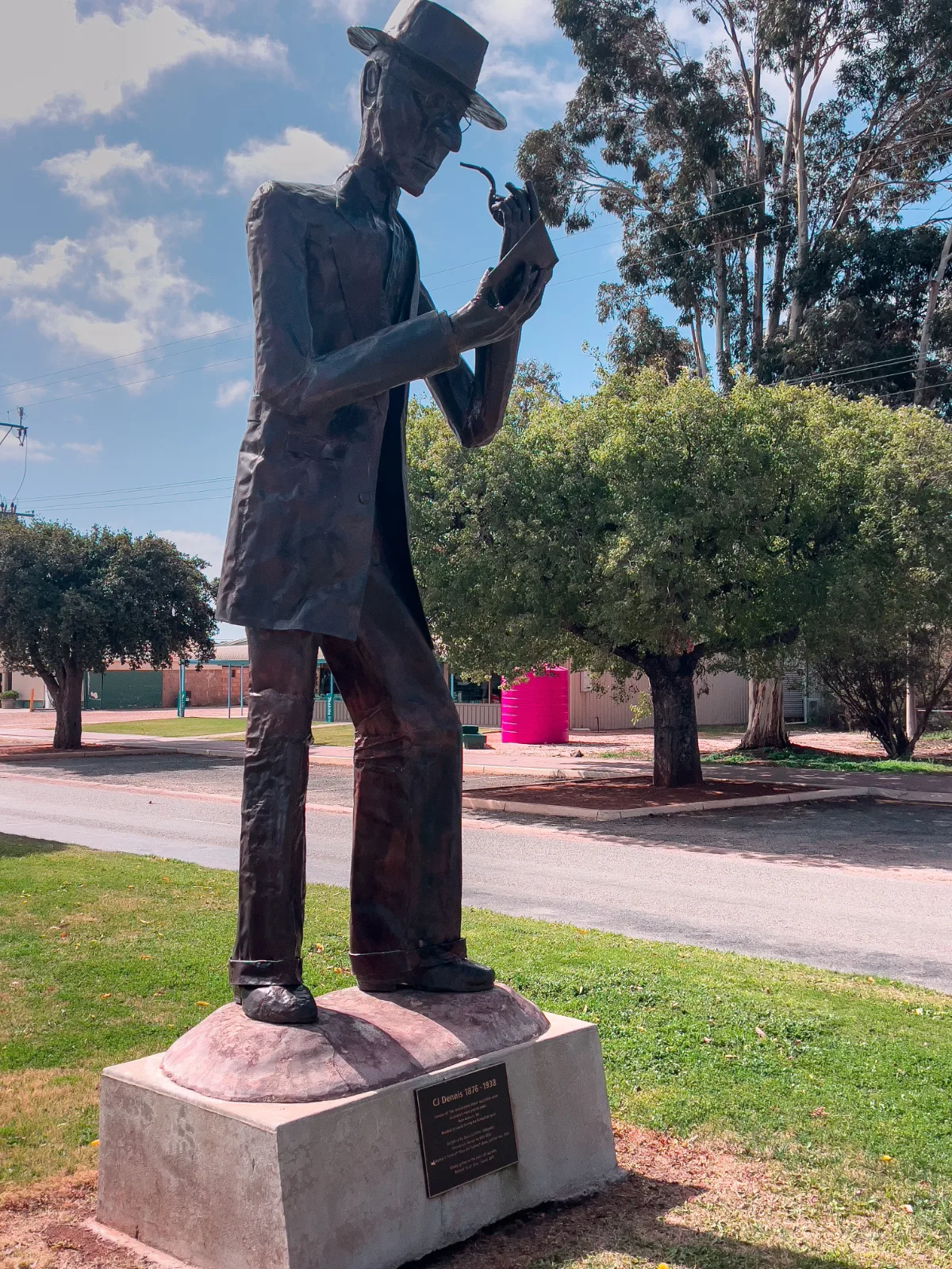 The statue of C.J. Dennis, a pensive literary figure forever capturing the essence of small-town life in Laura.