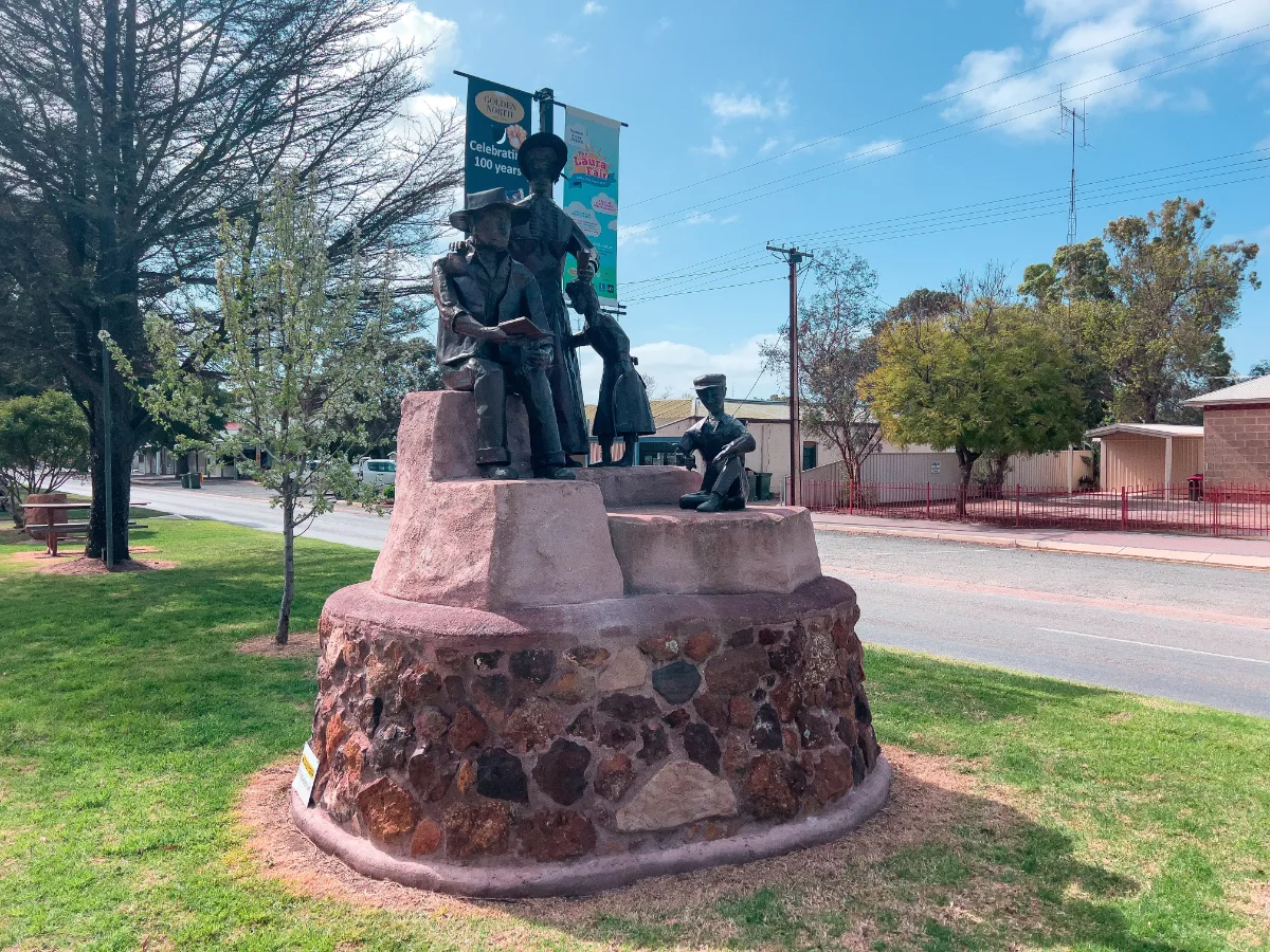 The pioneer family statue, a tribute to the resilience and spirit of Laura's early settlers.