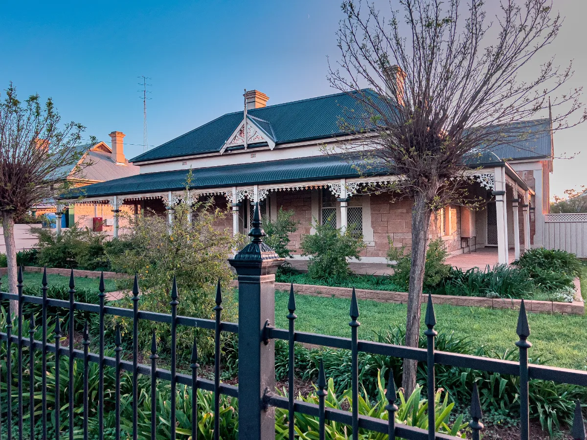 A beautiful heritage home in Crystal Brook, Barunga West Council, showcasing intricate ironwork and meticulously kept gardens.