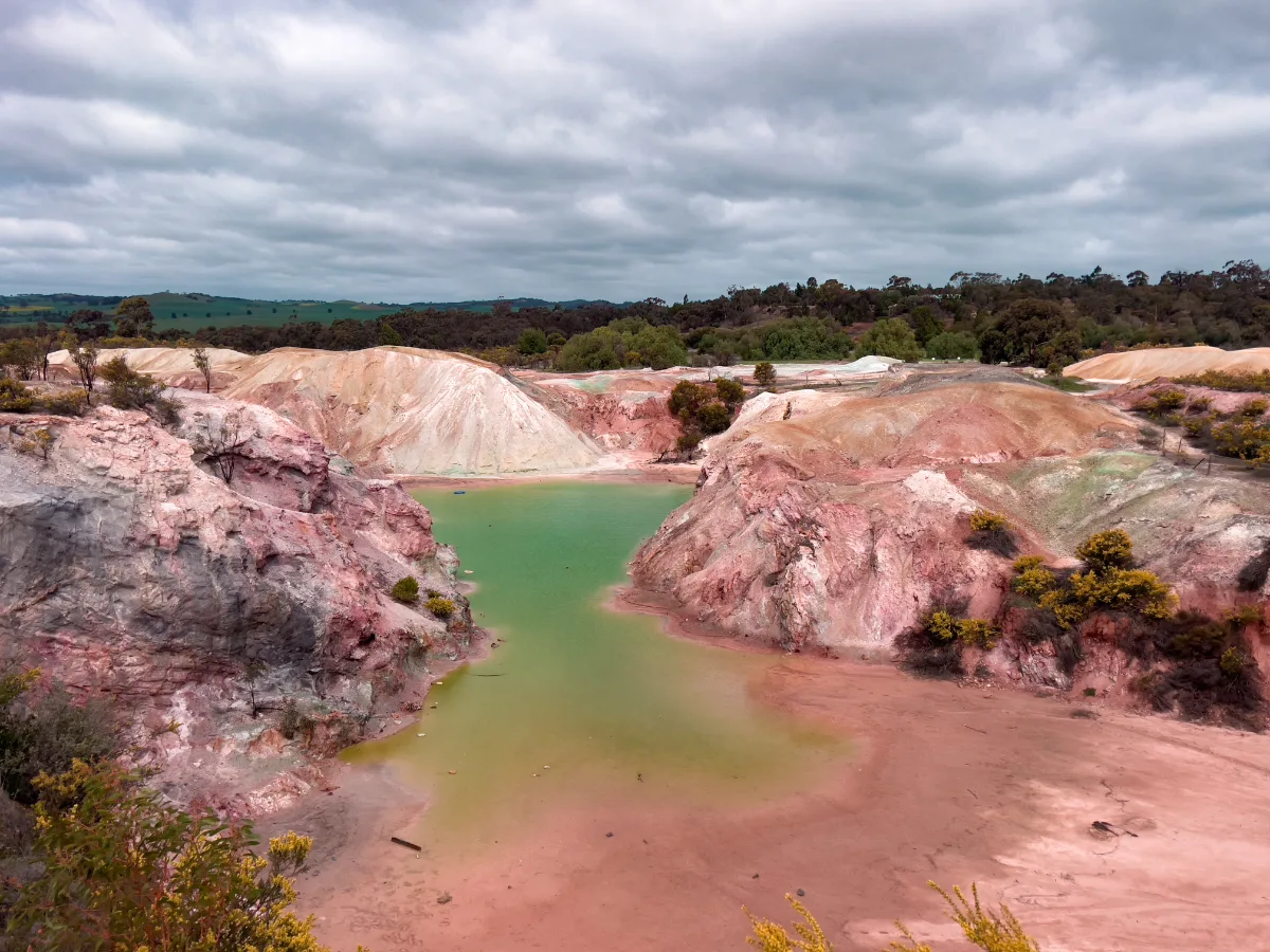 A panoramic view of the open-cut mine in Kapunda, the vibrant colors a stark contrast to the industrial activity that defined its past.