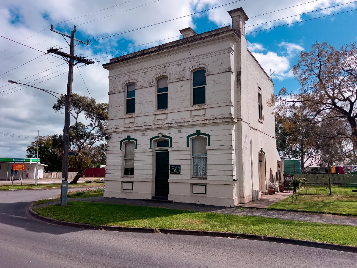 This old building in Murtoa, possibly a former bank, stands as a reminder of the town's rich history.