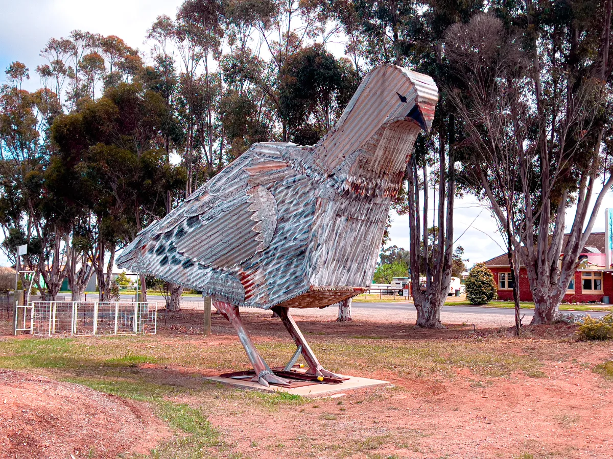 A giant Mallee fowl sculpture, crafted from corrugated iron, stands proudly as a testament to the town's resourcefulness and artistic creativity.