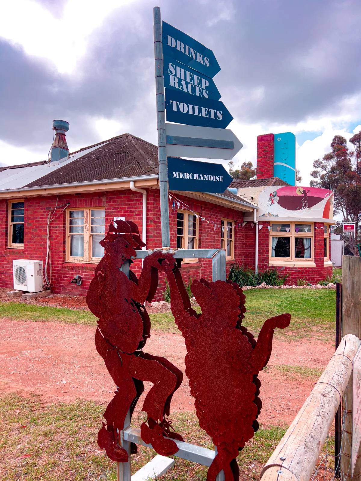Even the local pub gets in on the act with quirky metal artworks pointing the way to