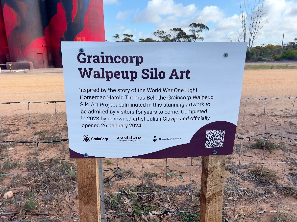 The information sign details the inspiration behind the artwork: Light Horseman Harold Thomas Bell. It also mentions Julian Clavijo, the artist responsible.