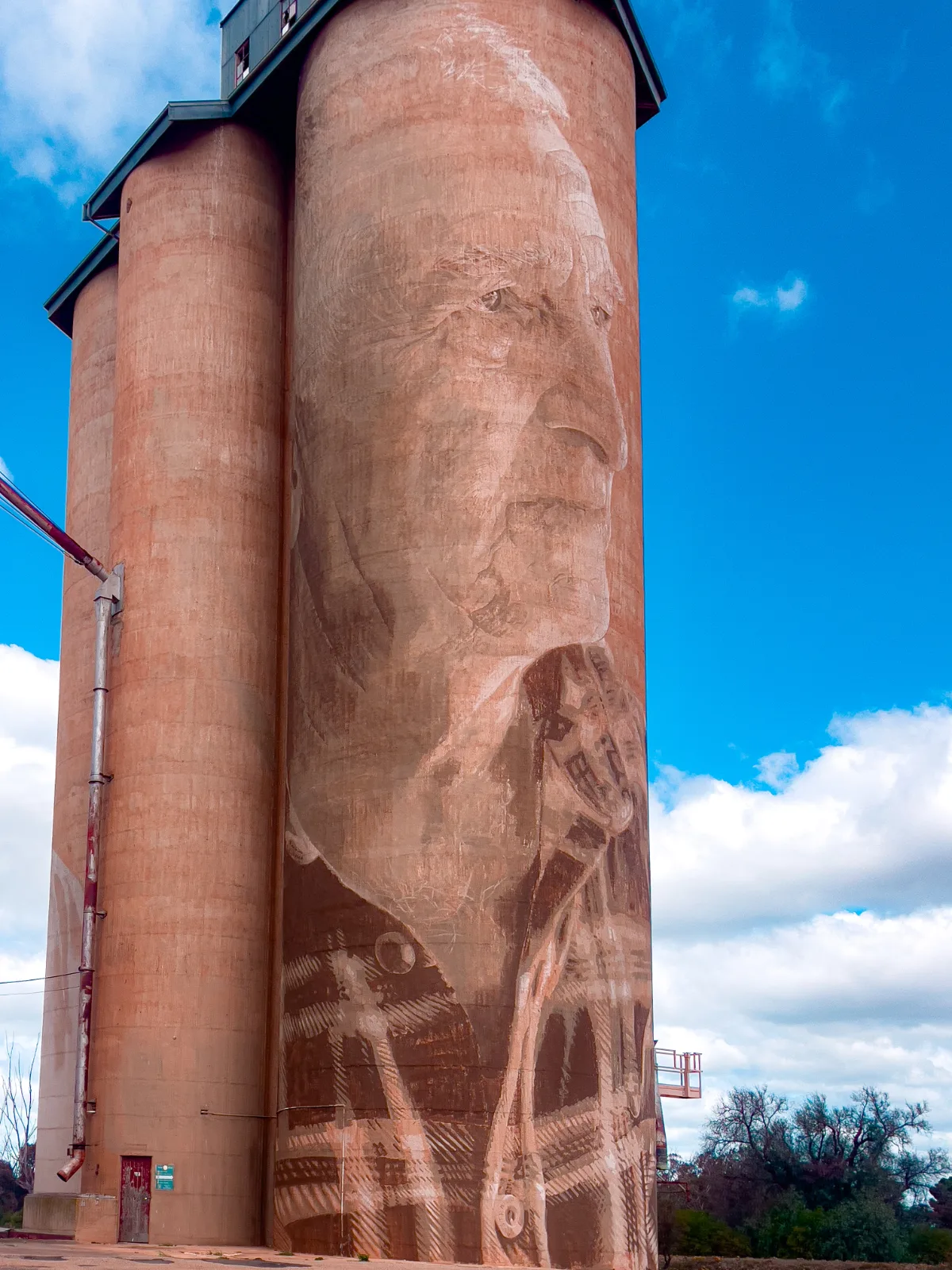 The mural of Geoff and Merrilyn Horman dominates the skyline of Lascelles, a testament to the community's agricultural heritage.