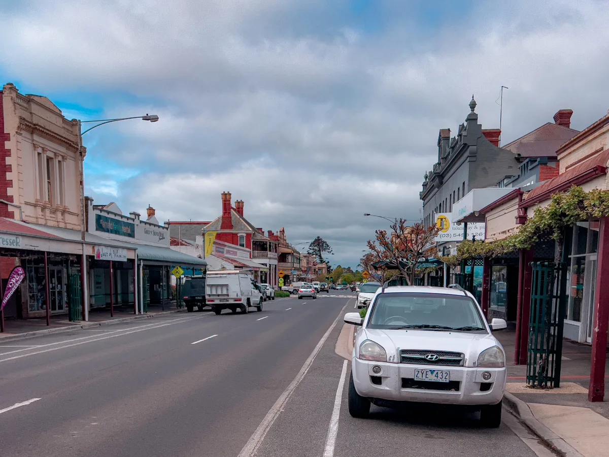 A long, straight street, lined with buildings that reflect the town's somber mood, highlighting the general dreariness pervading St Arnaud.