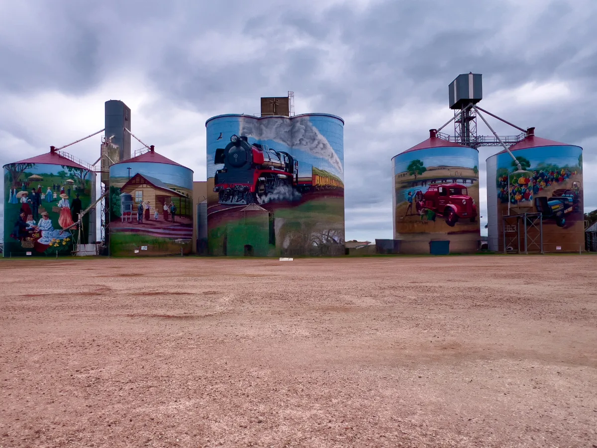The Colbinabbin silos rise majestically against a dramatic sky, each panel telling a different story.