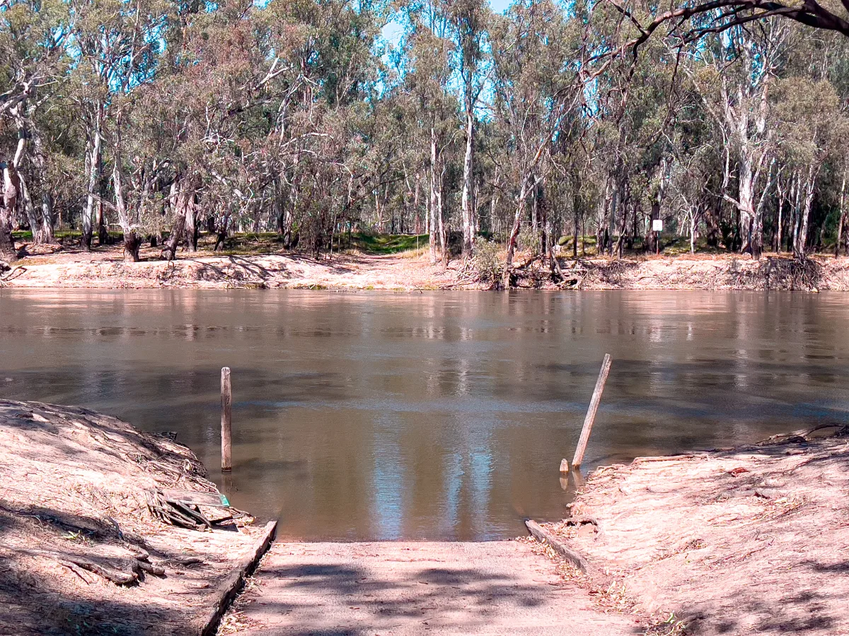 A boat ramp leading into the Murray River, a reminder of the river's enduring presence.