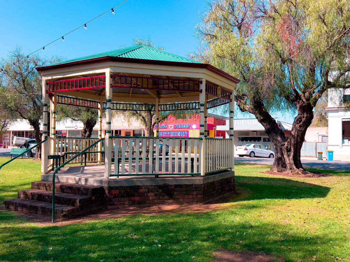 A central gazebo provides a shady place to rest in the park.