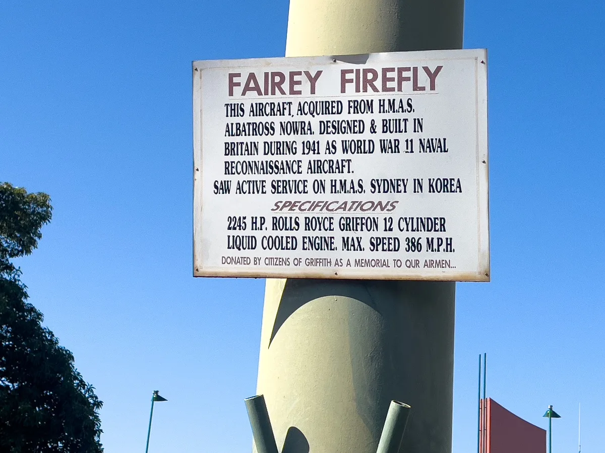A commemorative plaque details the history of the Fairey Firefly, donated as a memorial by the citizens of Griffith.