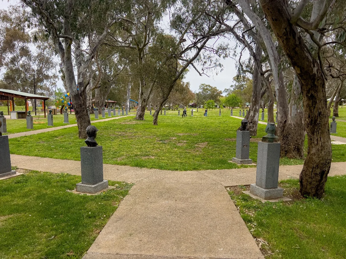 The cricket walk at a distance, a row of busts and the trees forming a natural gallery.