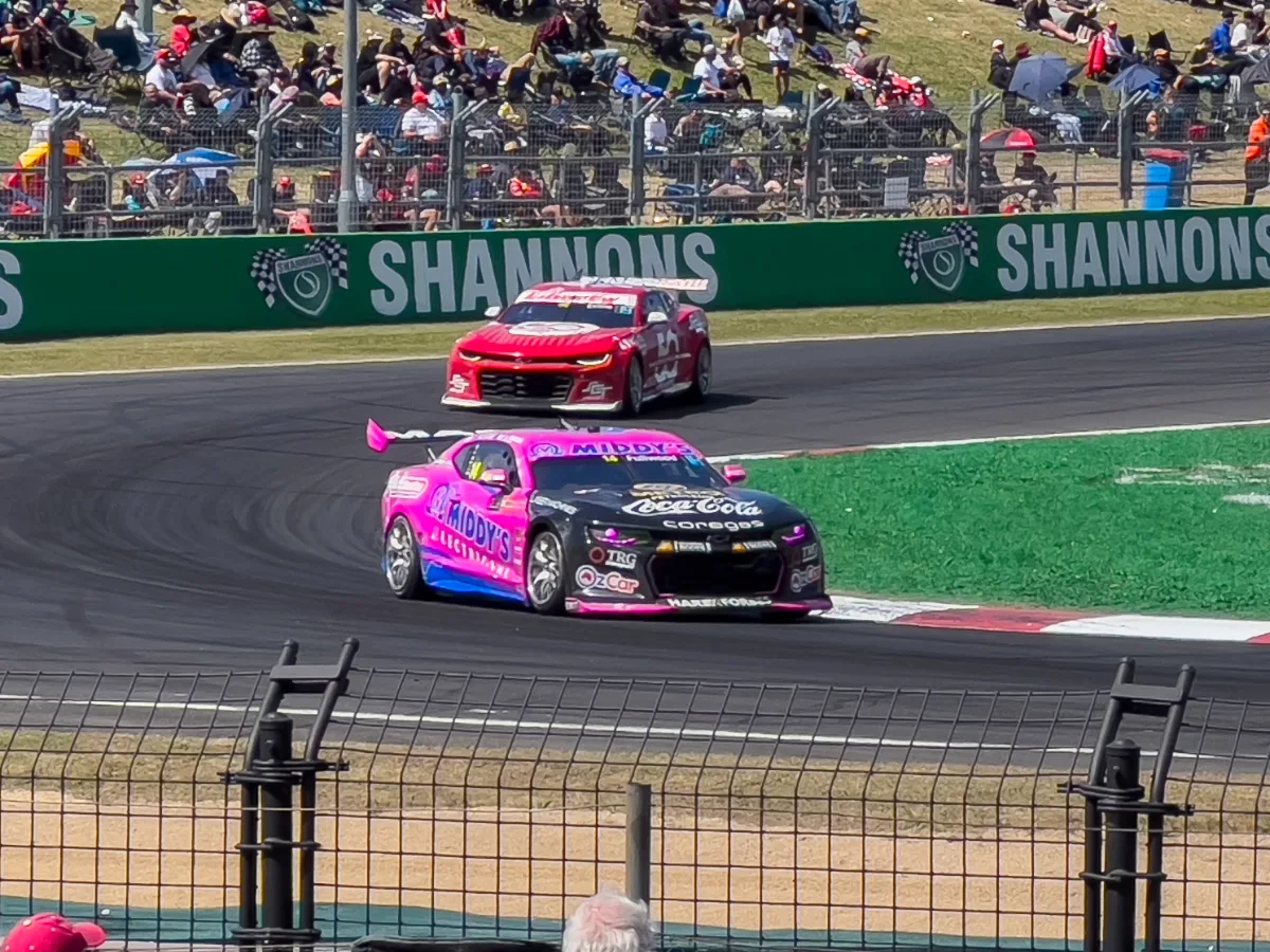 The pack battles hard for position midway through the race.