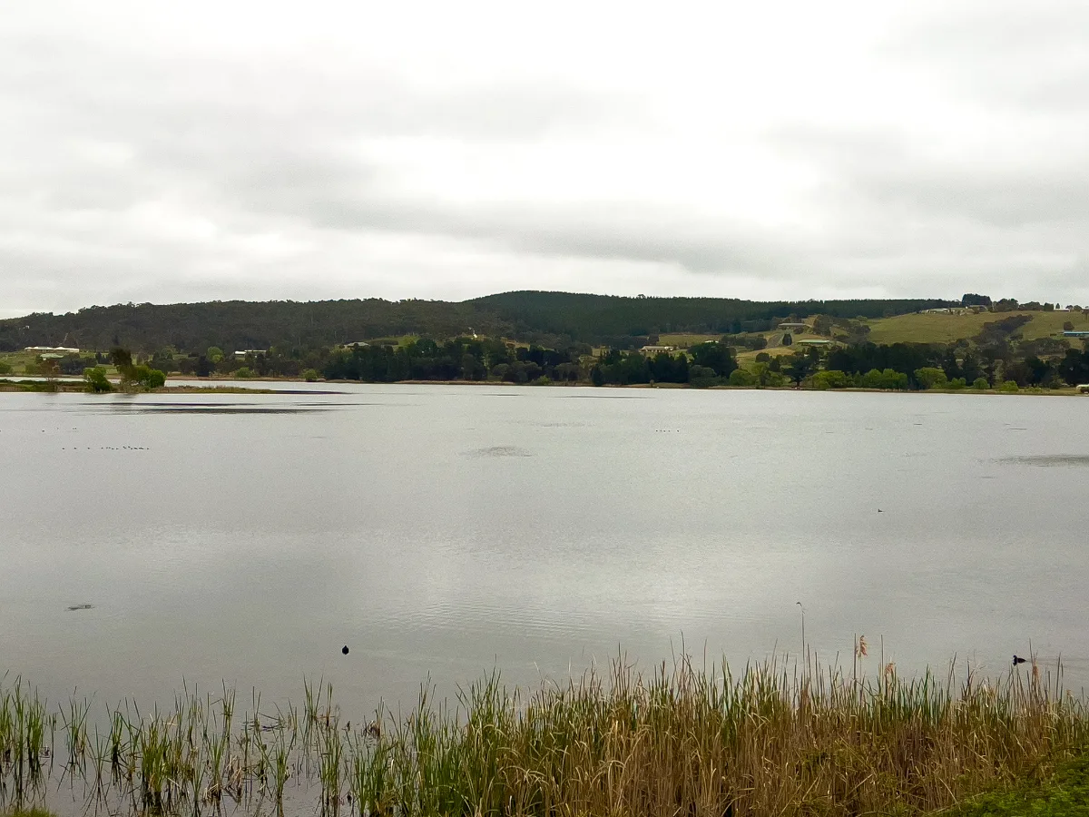Calm waters reflect the moody sky over the Wallerawang lake.
