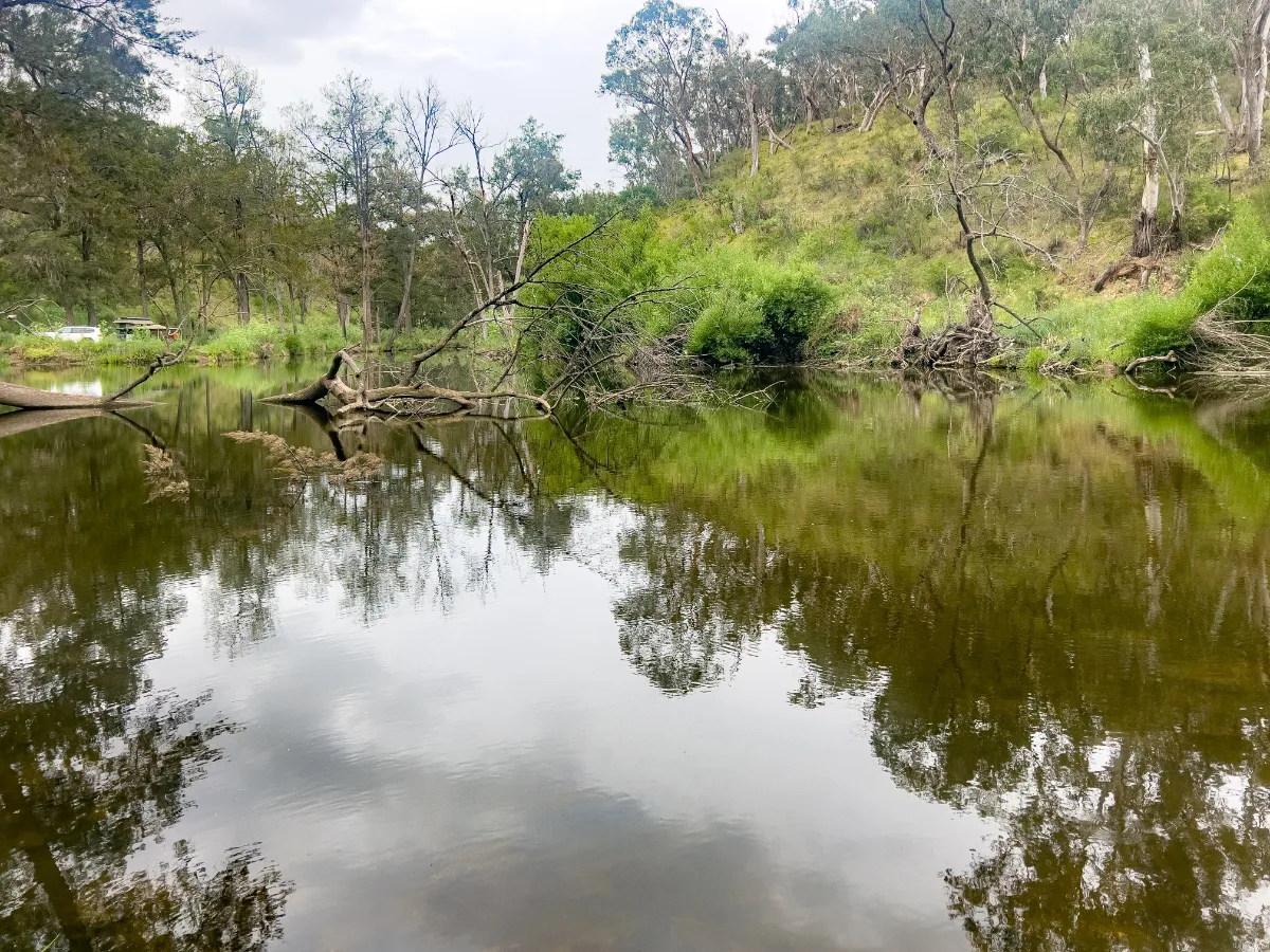 Reflections on the river at Ophir, a peaceful contrast to the area's industrious past.