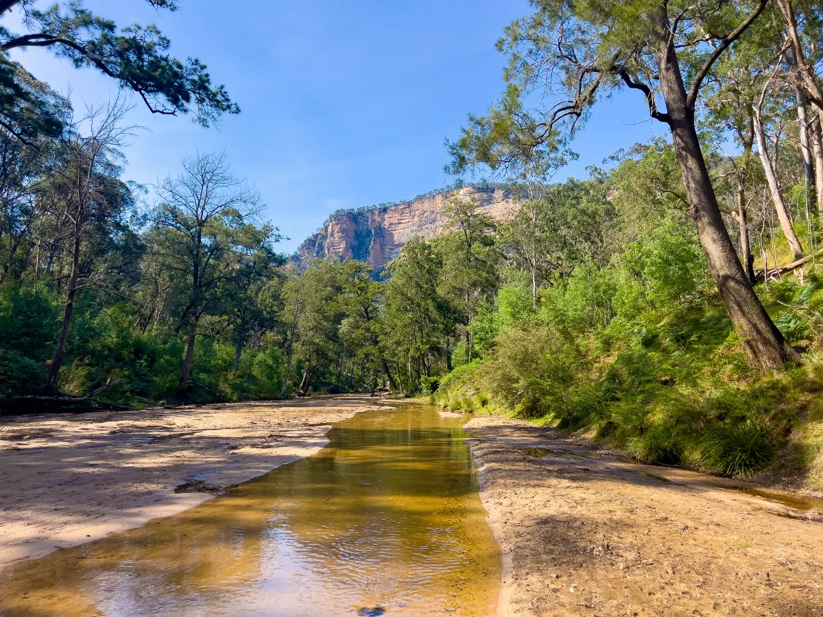 The clear waters of the river cut a path through the sandy flats of Glen Davis.
