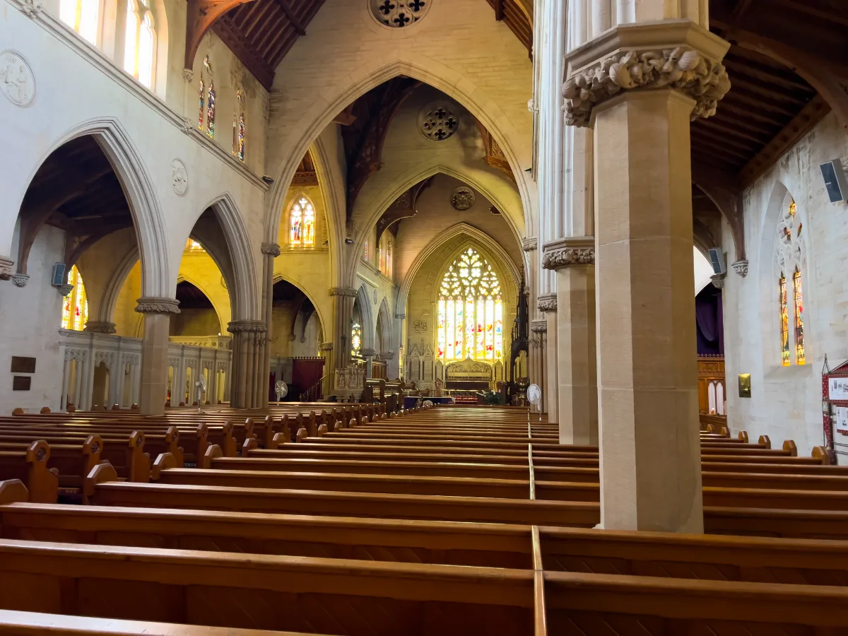 Light streams through the stained-glass windows of St. Saviour's Cathedral.