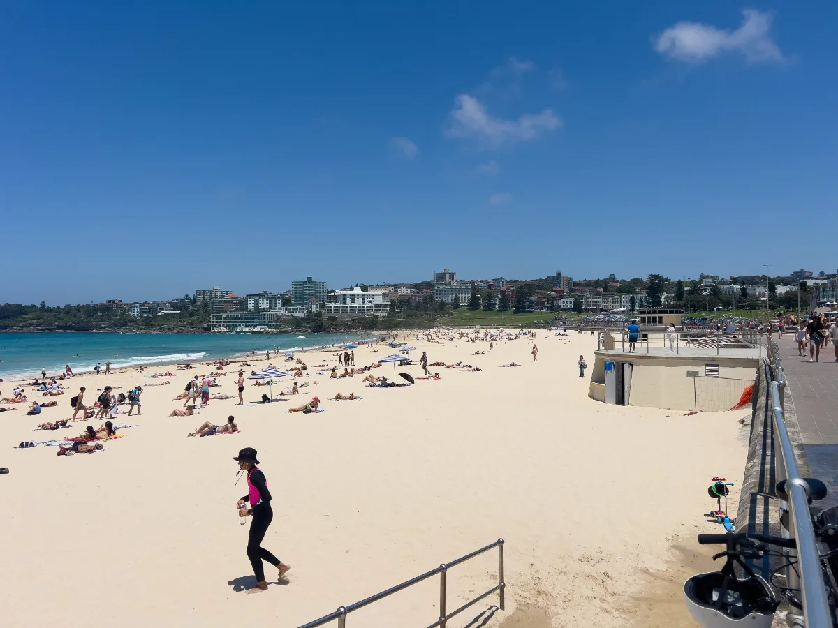 A classic view of Bondi Beach, alive with sunbathers and activity.
