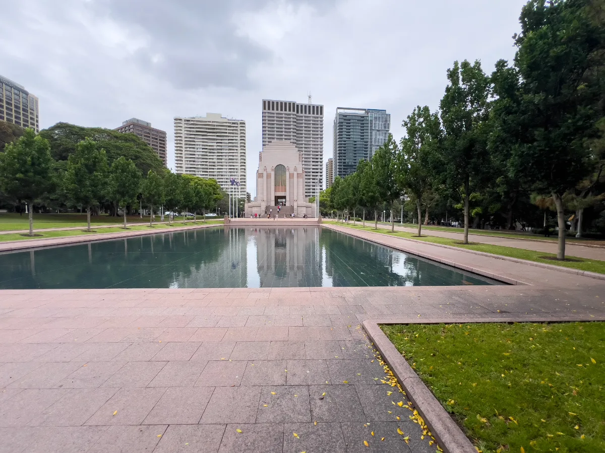 A reflecting pool in Hyde Park with the ANZAC memorial in the background