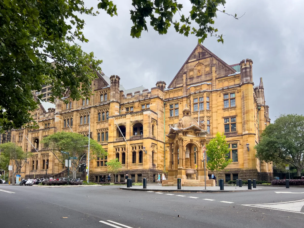 An impressive heritage building shows off the architectural details of its sandstone facade.