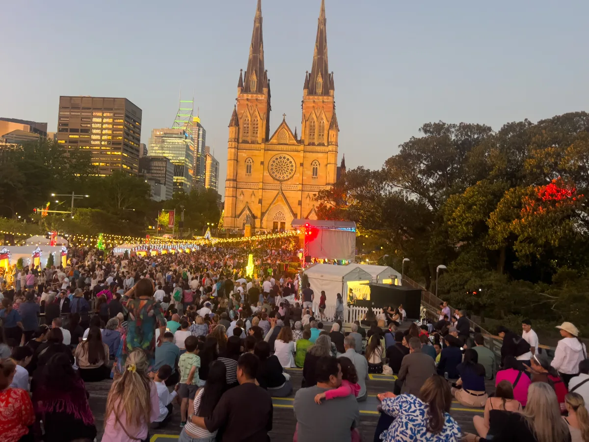 The excited crowd gathers in front of St. Mary's Cathedral, eagerly awaiting the start of the Christmas concert.