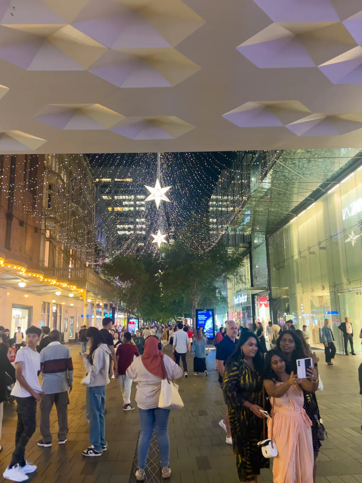 Festive lights and decorations adorn the streets of Sydney, creating a magical holiday atmosphere.