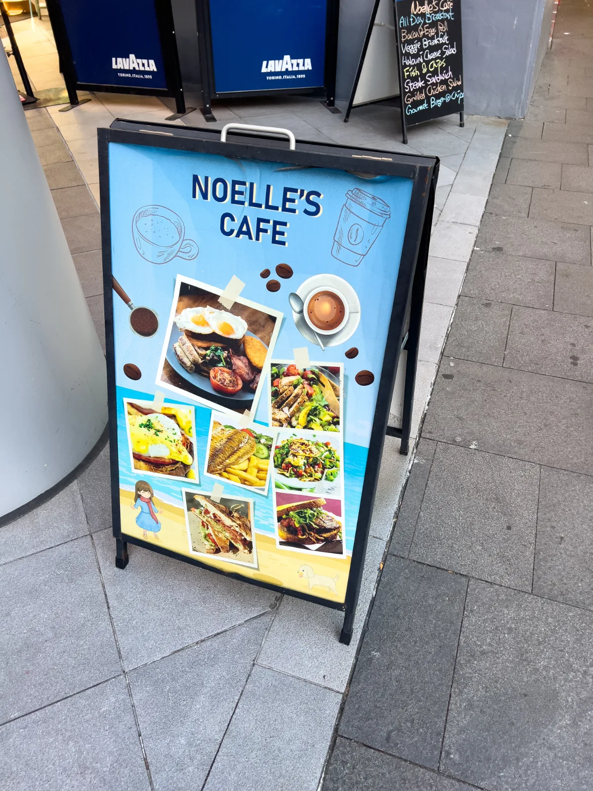 A sign outside Noelle's Cafe advertises its diverse menu and the promise of a satisfying meal.