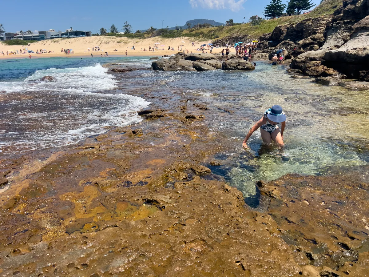 Lisa cautiously enters one of Wollongong's inviting rock pools, seeking a refreshing start to the new year.