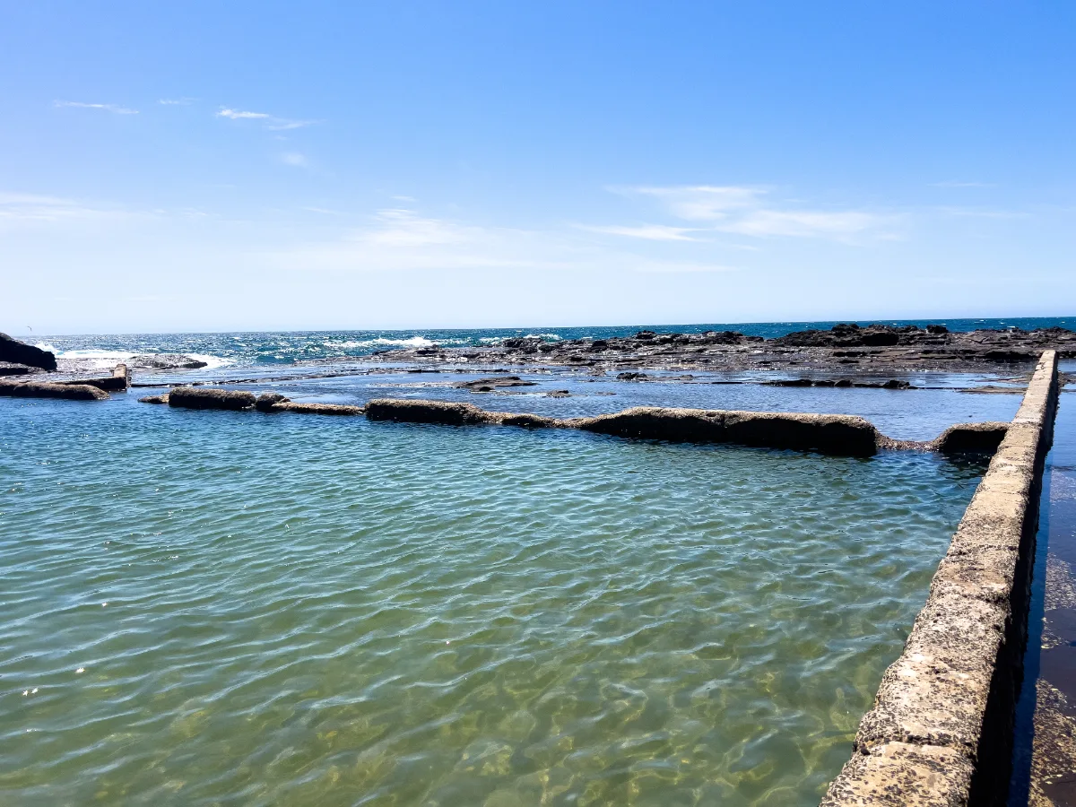 The clear, calm waters of the Gerringong rock pool invite exploration.