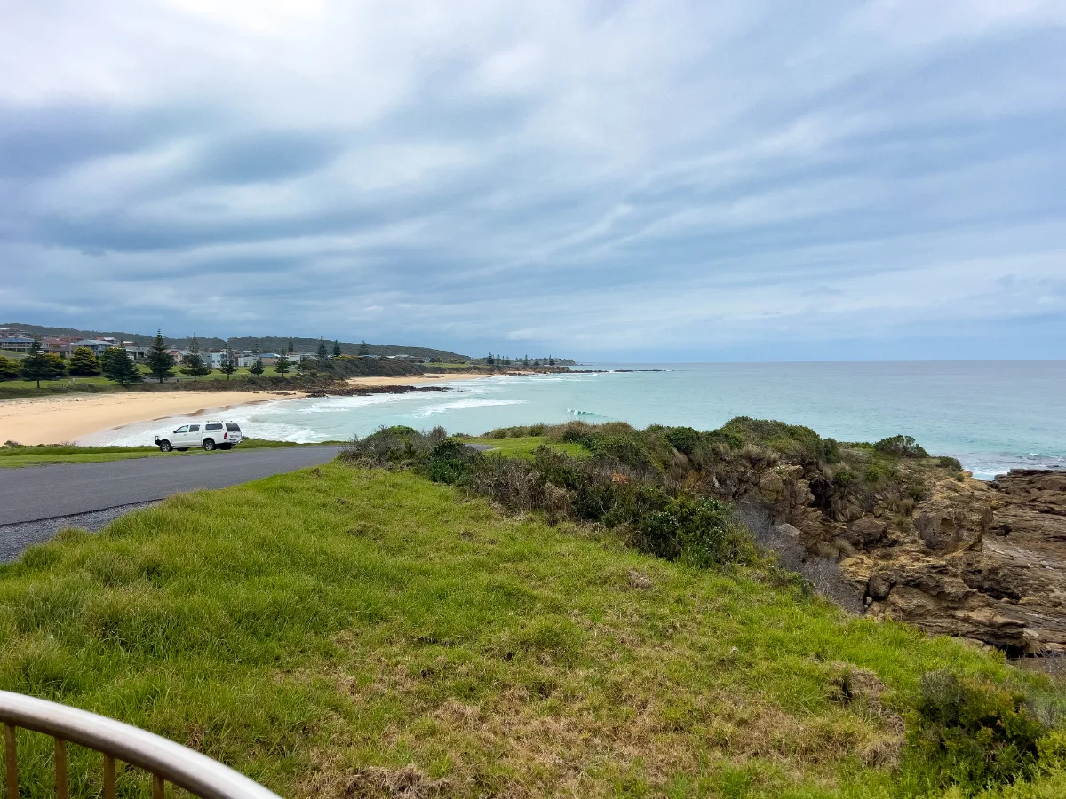 A picturesque view of the beach in North Narooma on an overcast day. The blue water is quite inviting.