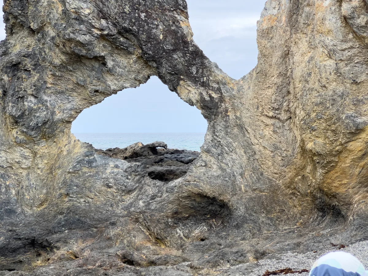 Weathered rock formations create natural sculptures along the coast of North Narooma.