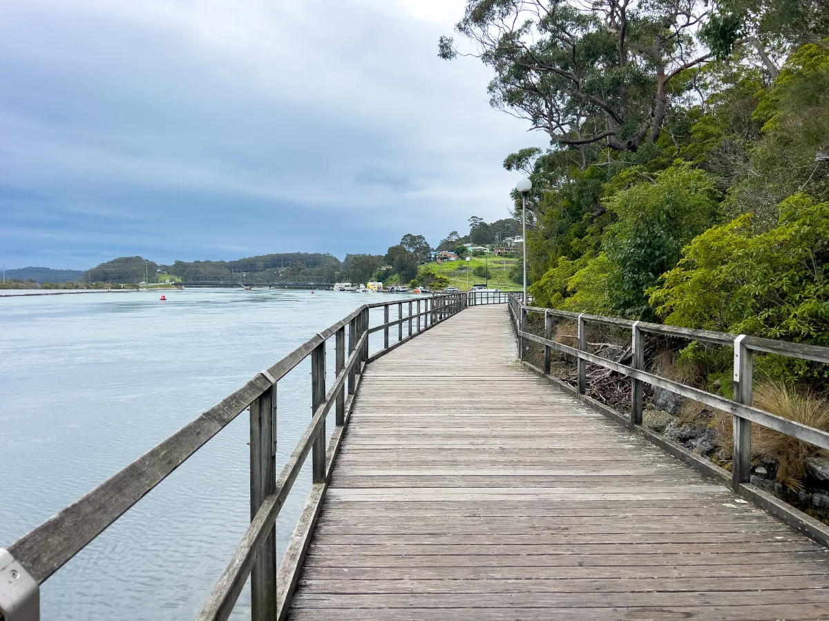 A pleasant boardwalk meanders along the shoreline, offering stunning views of the water.
