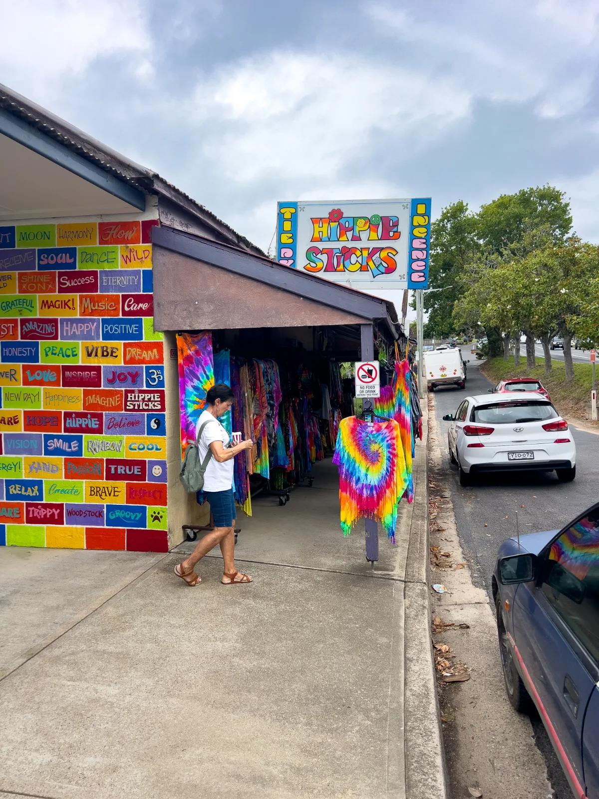 A customer browsing the tie-dye wares at Hippie Sticks.