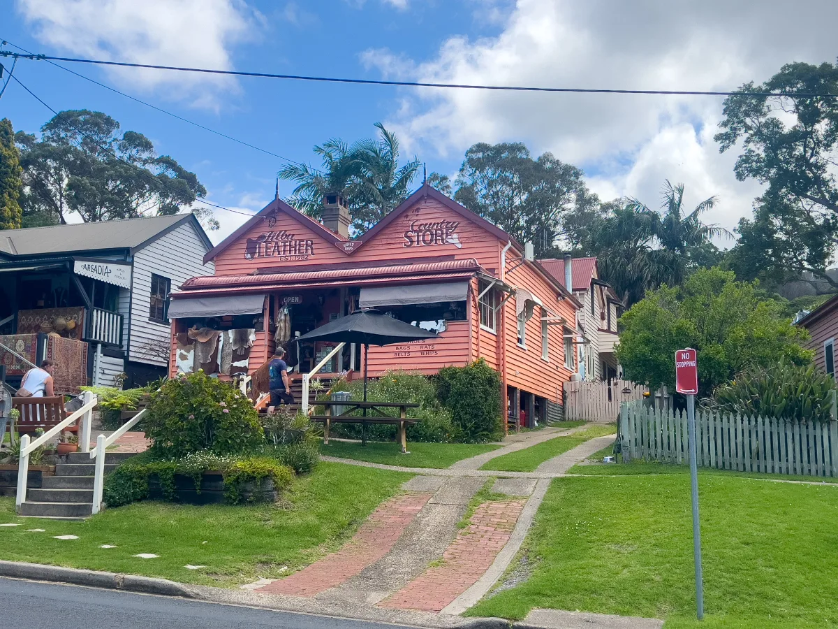 A rustic building houses the Feather Merchant and Second Storey Store.