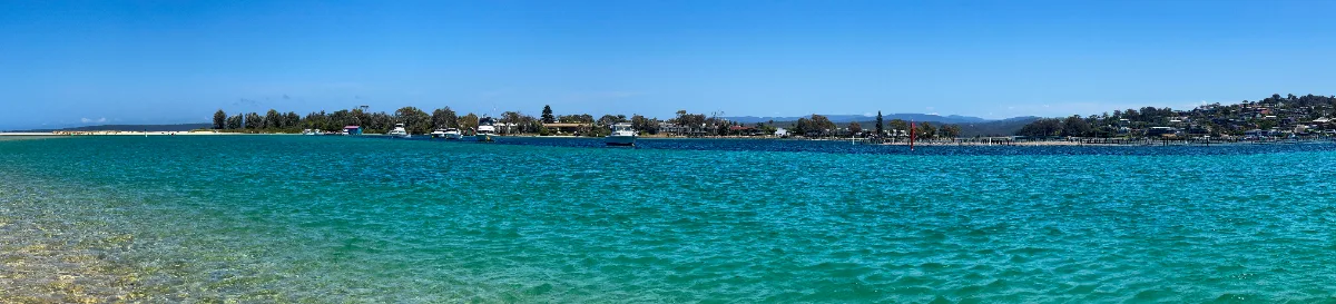 A panoramic view of the Merimbula coastline reveals its stunning beauty.