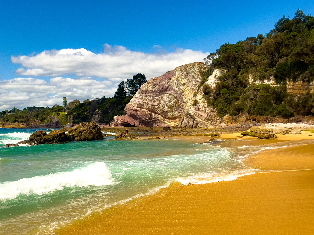 Waves gently caress the rocky shore of Eden, revealing the rugged beauty of the coastline.