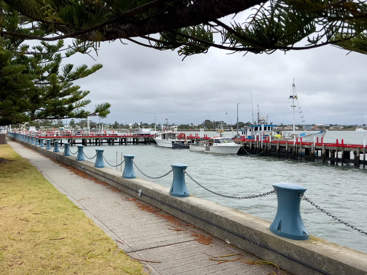 A tranquil morning on the Port Albert pier, with fishing boats awaiting their next voyage.