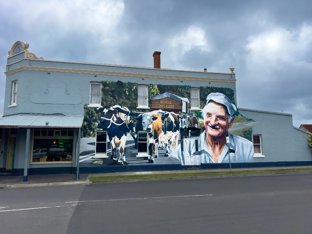 A striking mural on the side of a building in Yarram celebrating the dairy industry.