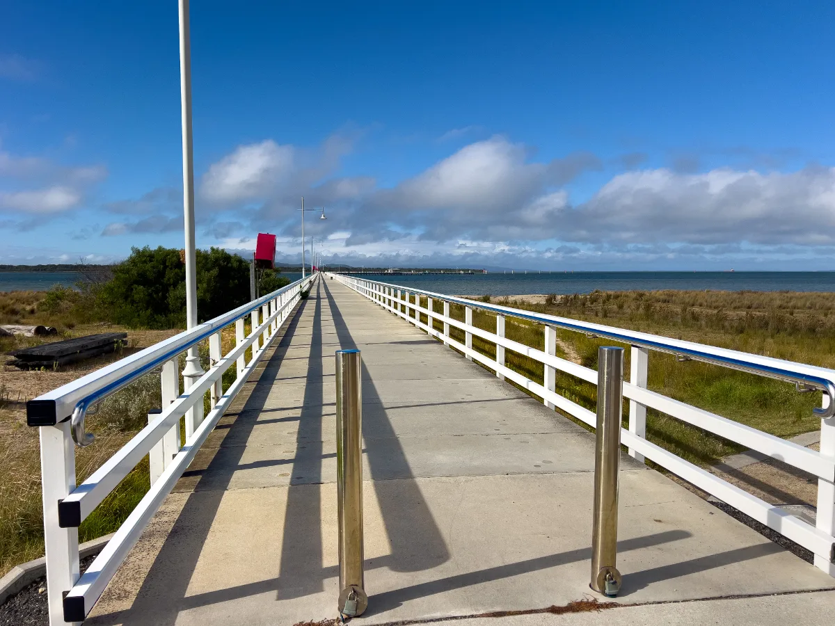 The straight, seemingly endless path of the Long Jetty beckons visitors for a refreshing walk above the waves.