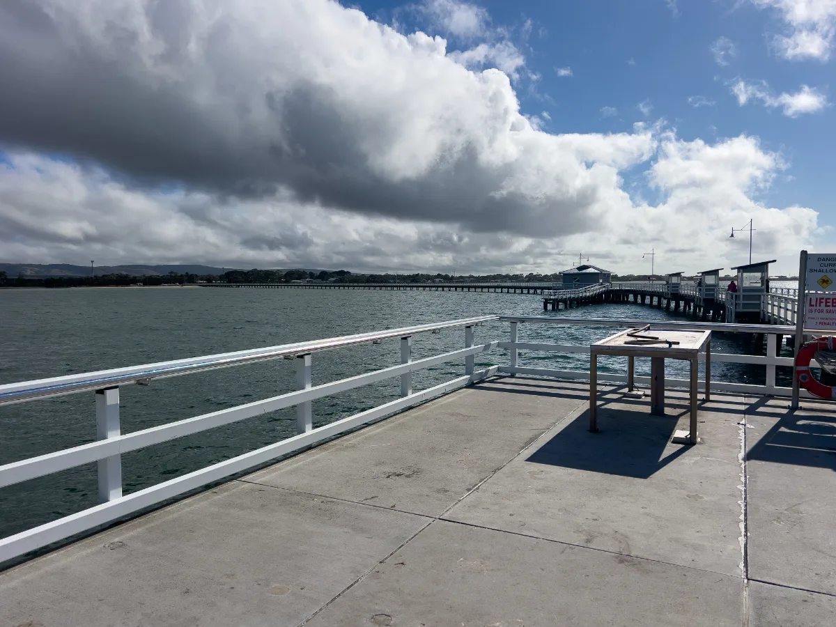 At the end of the Long Jetty, the panorama of water and sky offers a sense of serene isolation, perfect for contemplation or perhaps a spot of fishing.