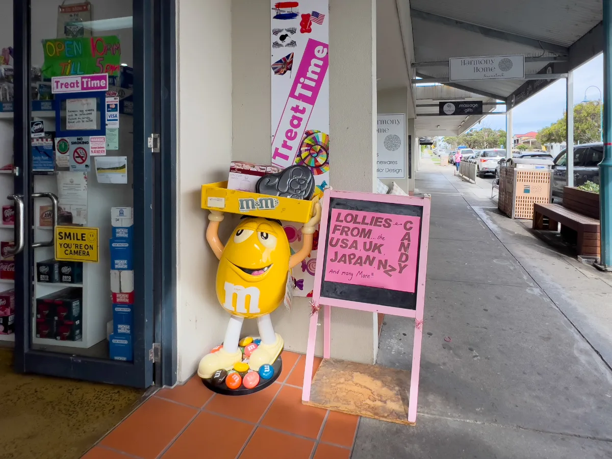 A candy store beckons, promising treats from around the globe.