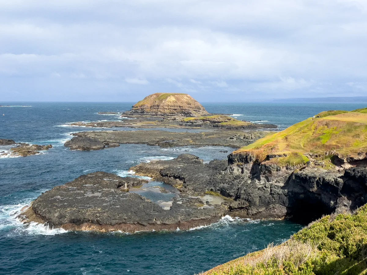 An impressive rock formation off the coast of Bass Coast, shaped by eons of erosion.