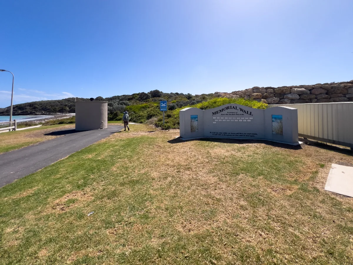 Carpenter Rock's Memorial Wall, a somber tribute to those lost at sea.