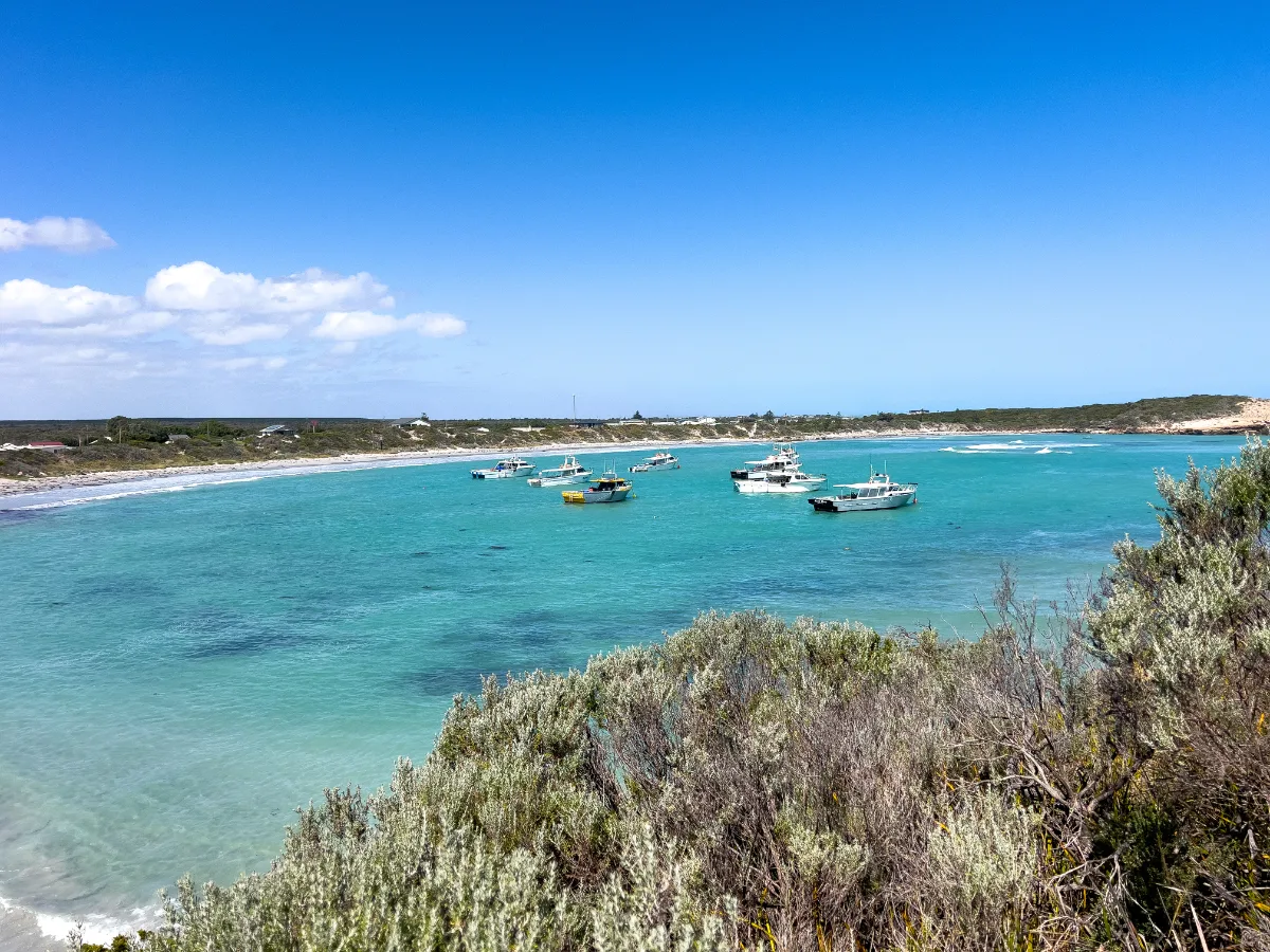 A flotilla of crayboats sits just offshore, evidence of Carpenter Rock's ties to the fishing industry.