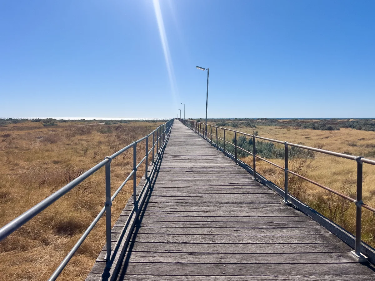 The Cape Jaffa Lighthouse boardwalk stretches into the distance, a straight shot to maritime history.