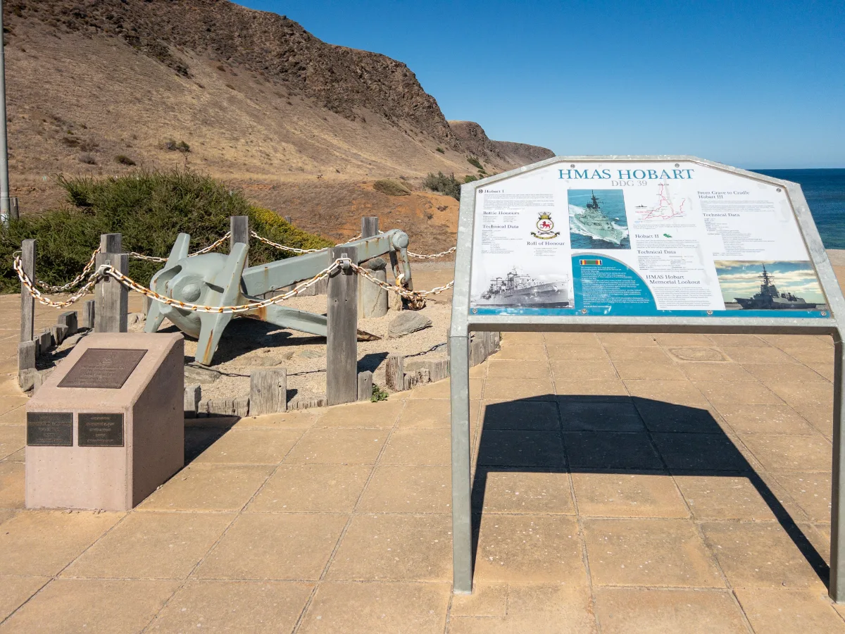 A memorial display at Wirrina Cove featuring an anchor from the HMAS Hobart, providing a tangible connection to the ship's service history.