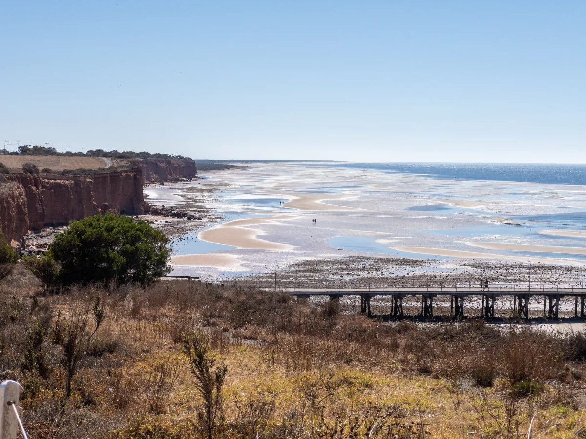Red cliffs meet the sea, creating a stunning contrast along the Ardrossan coastline.