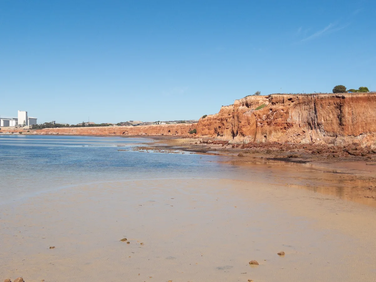 The red cliffs tower behind the town, a reminder of the geological forces that shaped Ardrossan.
